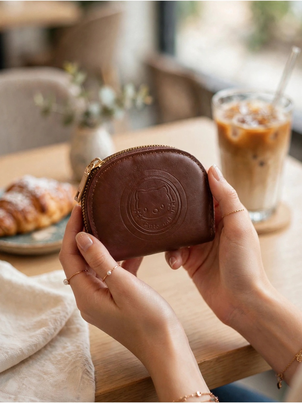 Brown Leather Coin Pouch with Embossed Hello Kitty Motif
